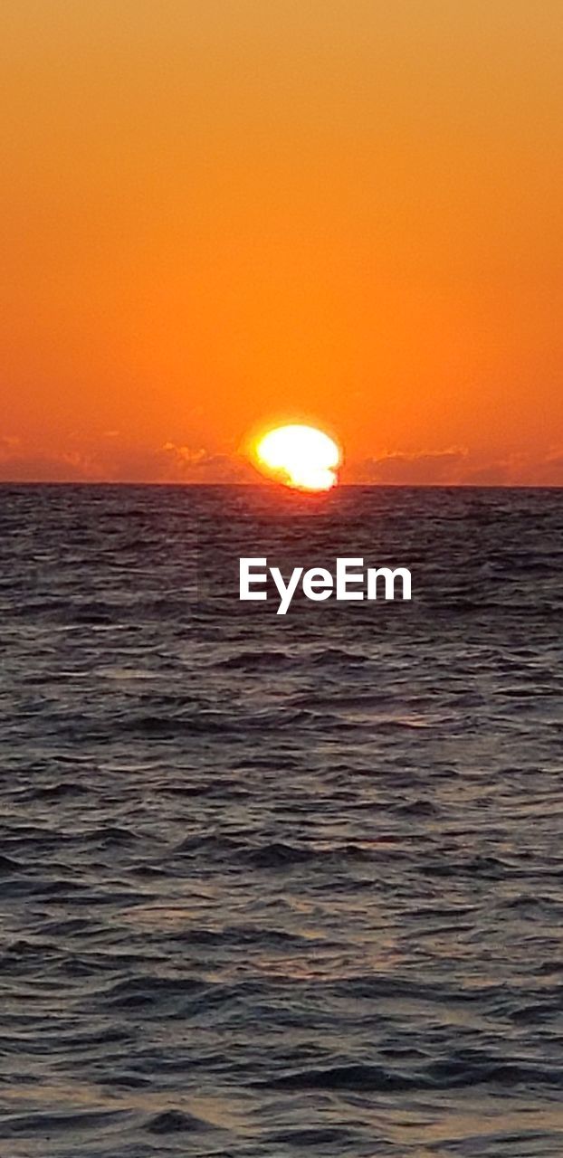 SCENIC VIEW OF SEA DURING SUNSET