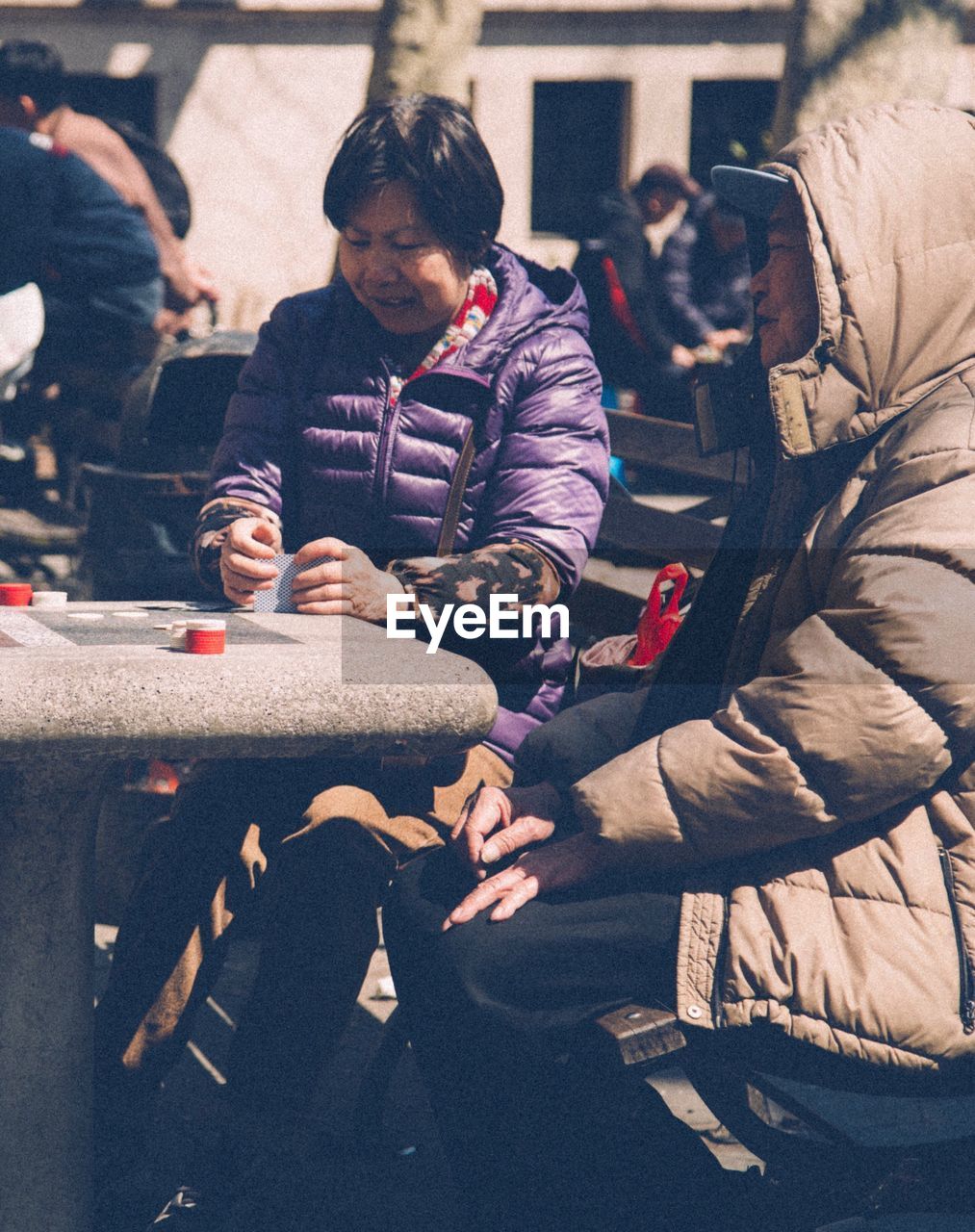 HIGH ANGLE VIEW OF PEOPLE AT MARKET