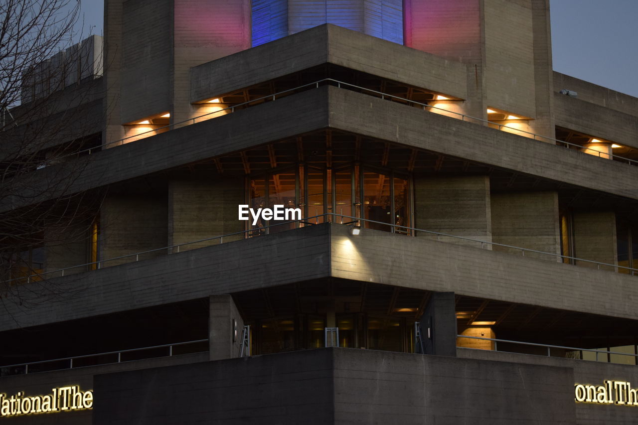 LOW ANGLE VIEW OF ILLUMINATED BUILDING