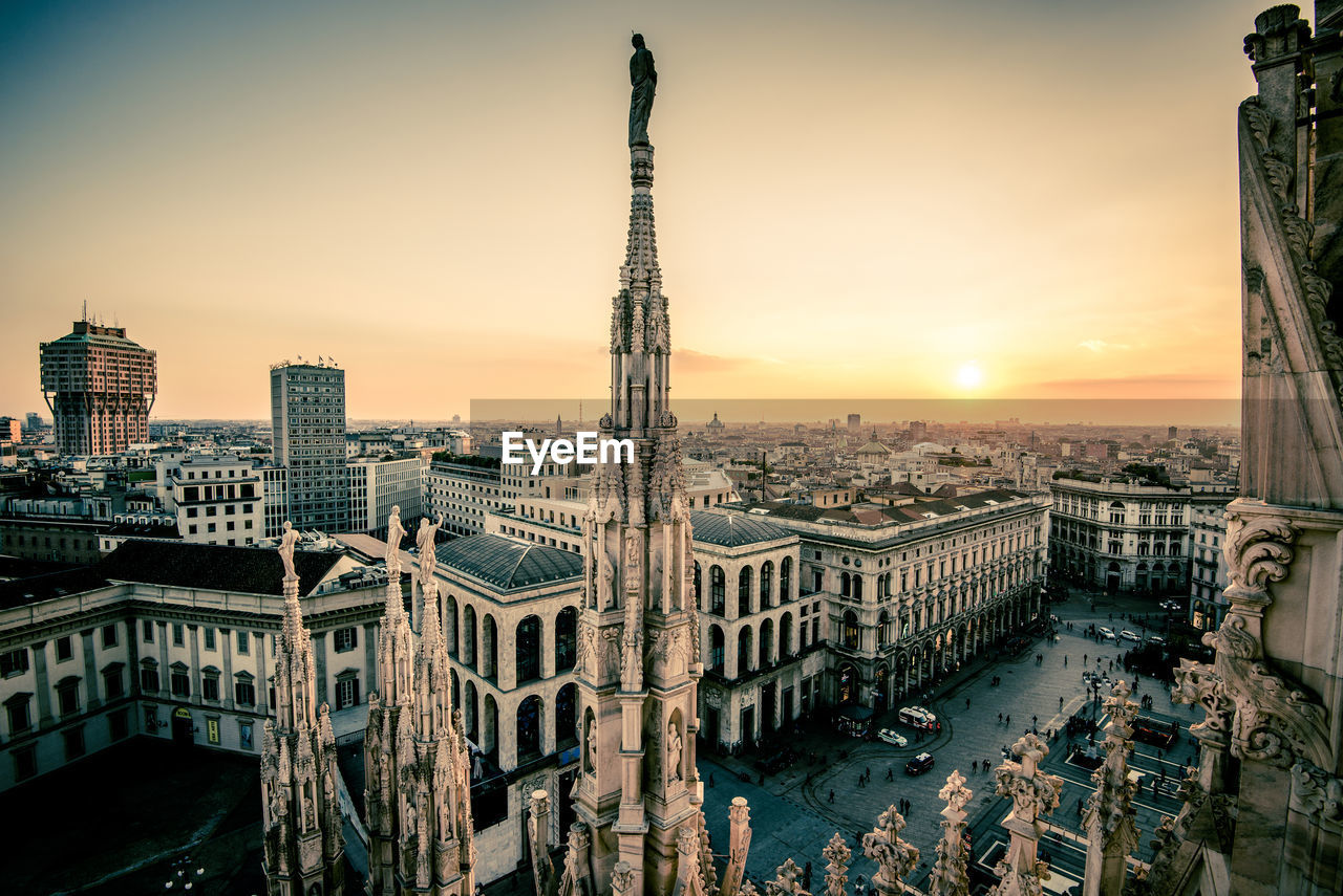 Cityscape against sky during sunset