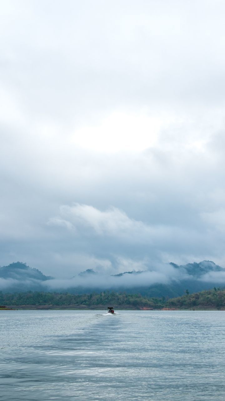 SCENIC VIEW OF BOAT SAILING ON SEA AGAINST SKY