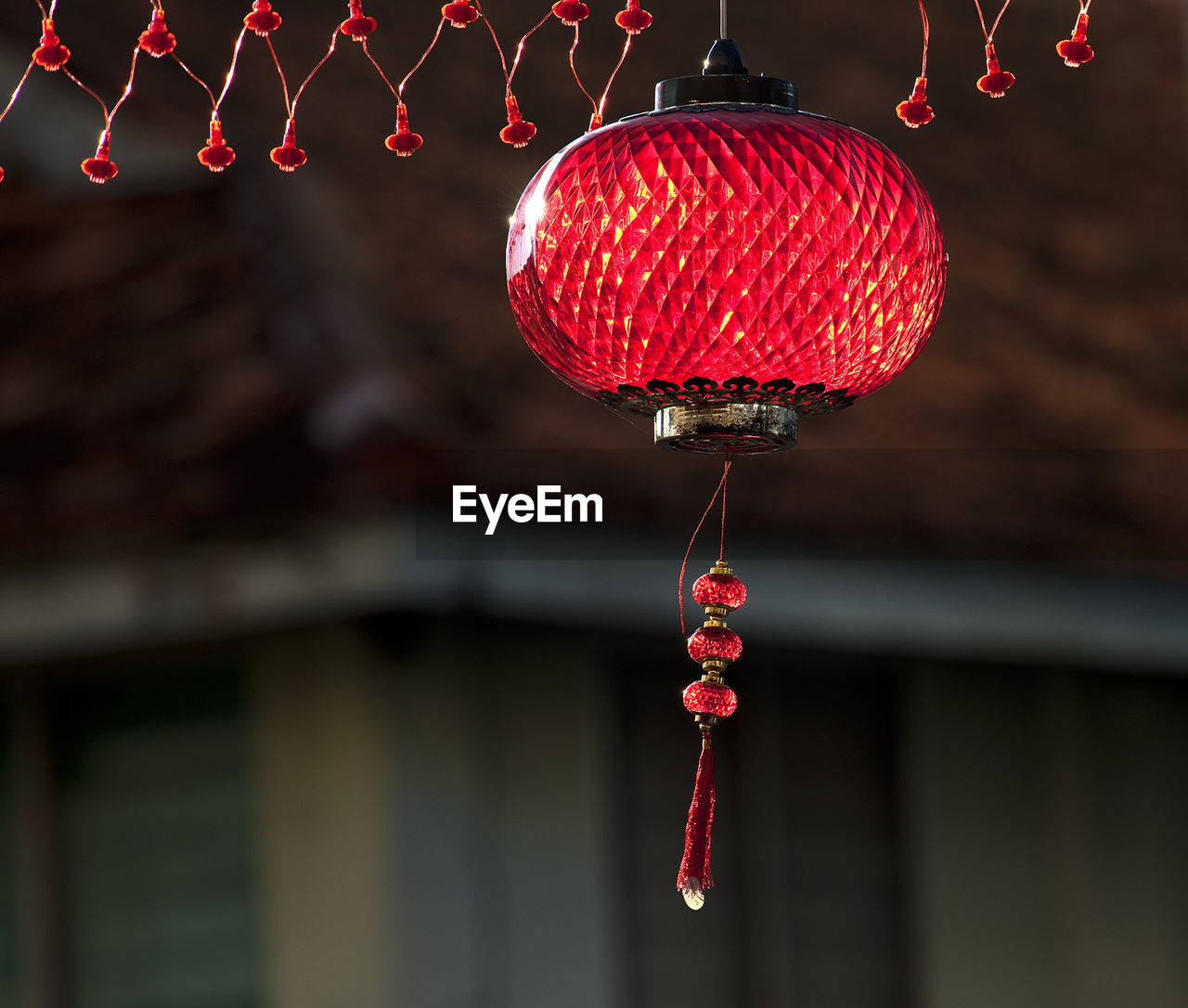 Low angle view of lantern hanging at doorway