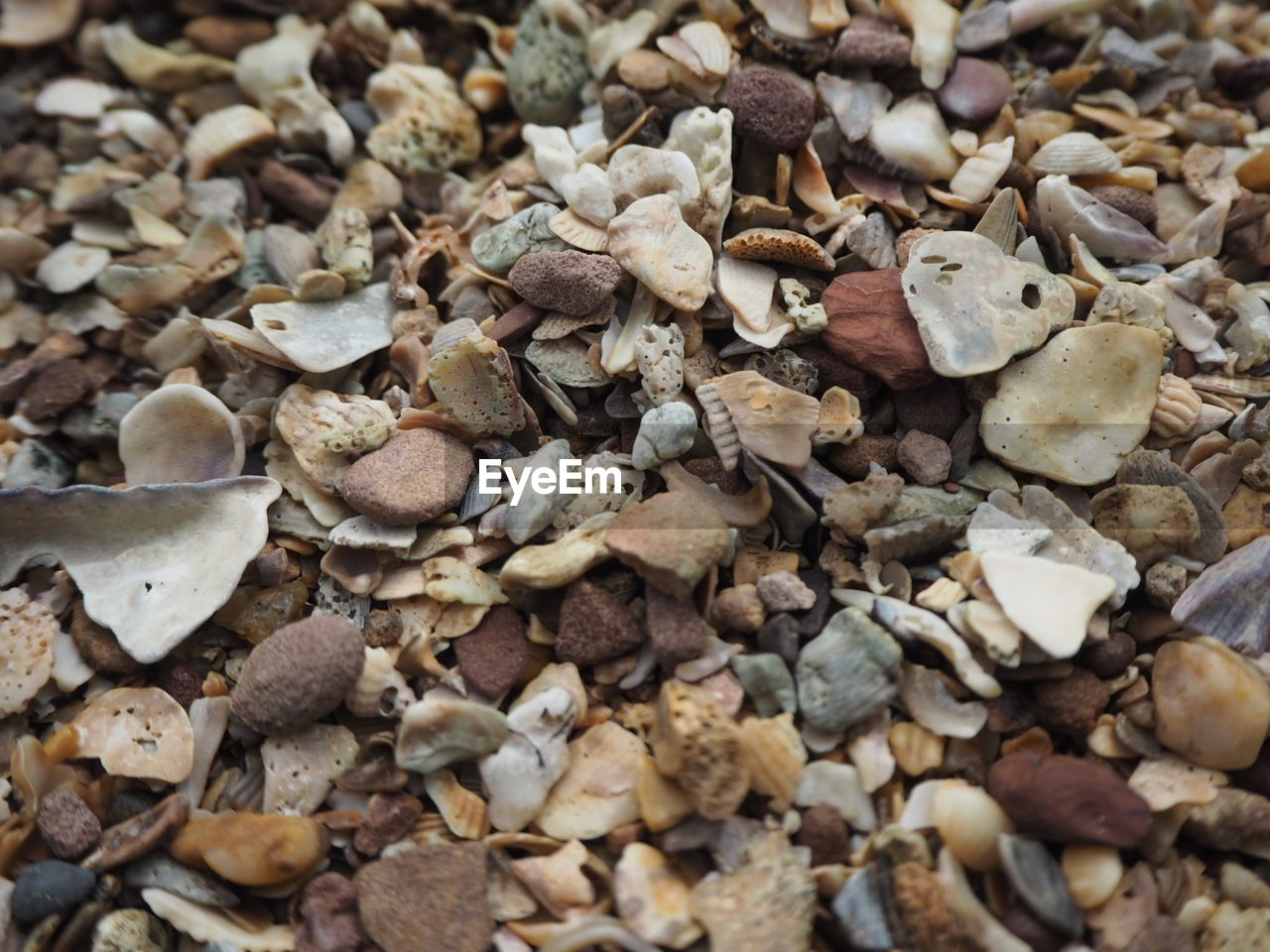FULL FRAME SHOT OF PEBBLES ON LAND