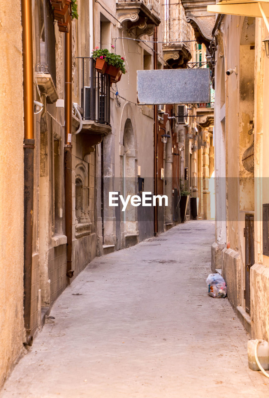 ALLEY AMIDST BUILDINGS