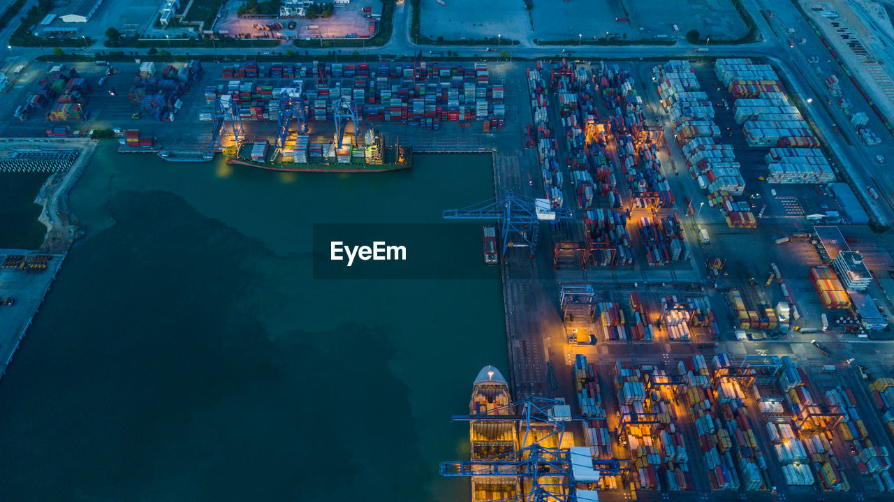 High angle view of container ship at commercial dock