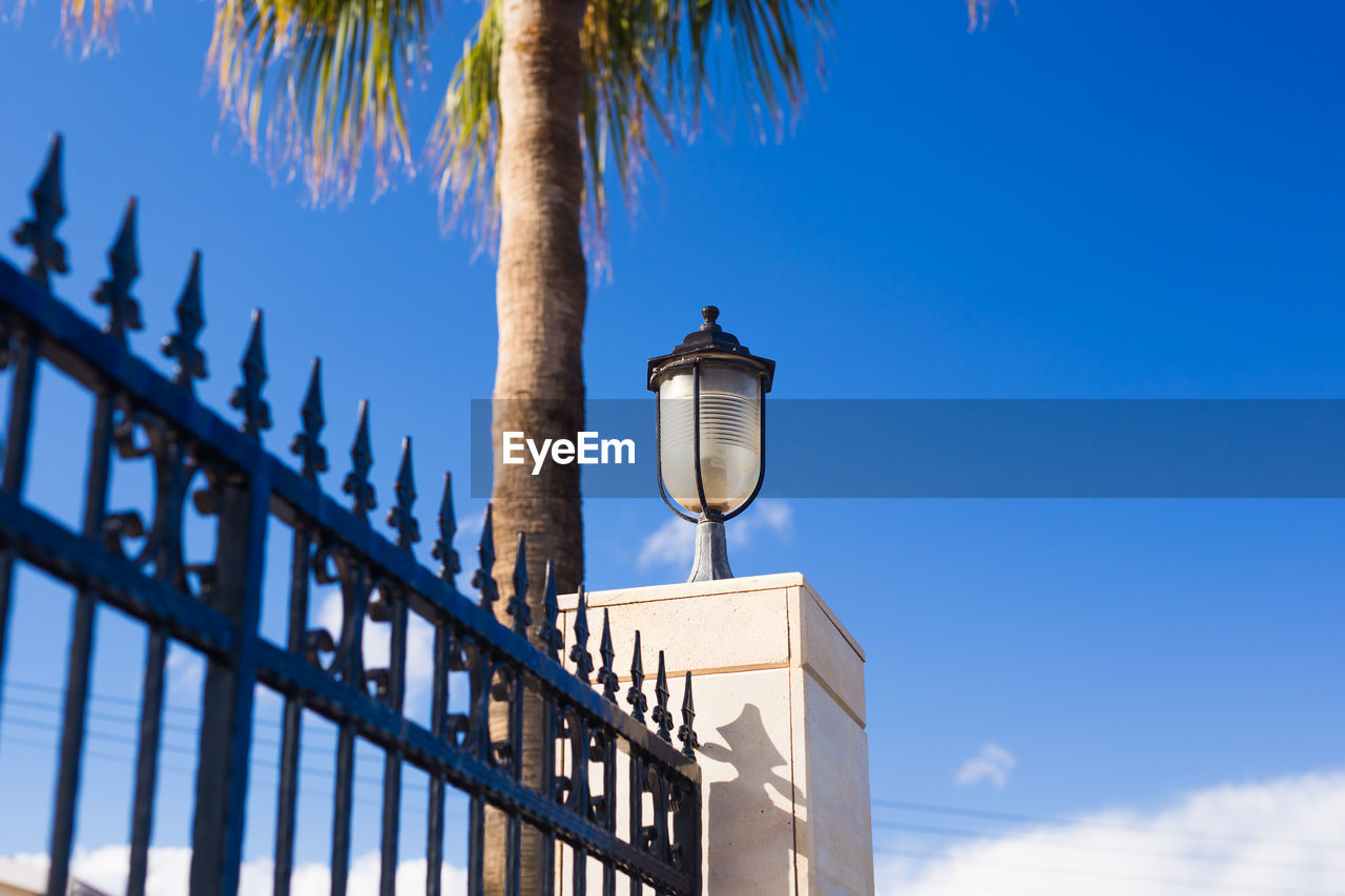 LOW ANGLE VIEW OF STREET LIGHT AGAINST SKY