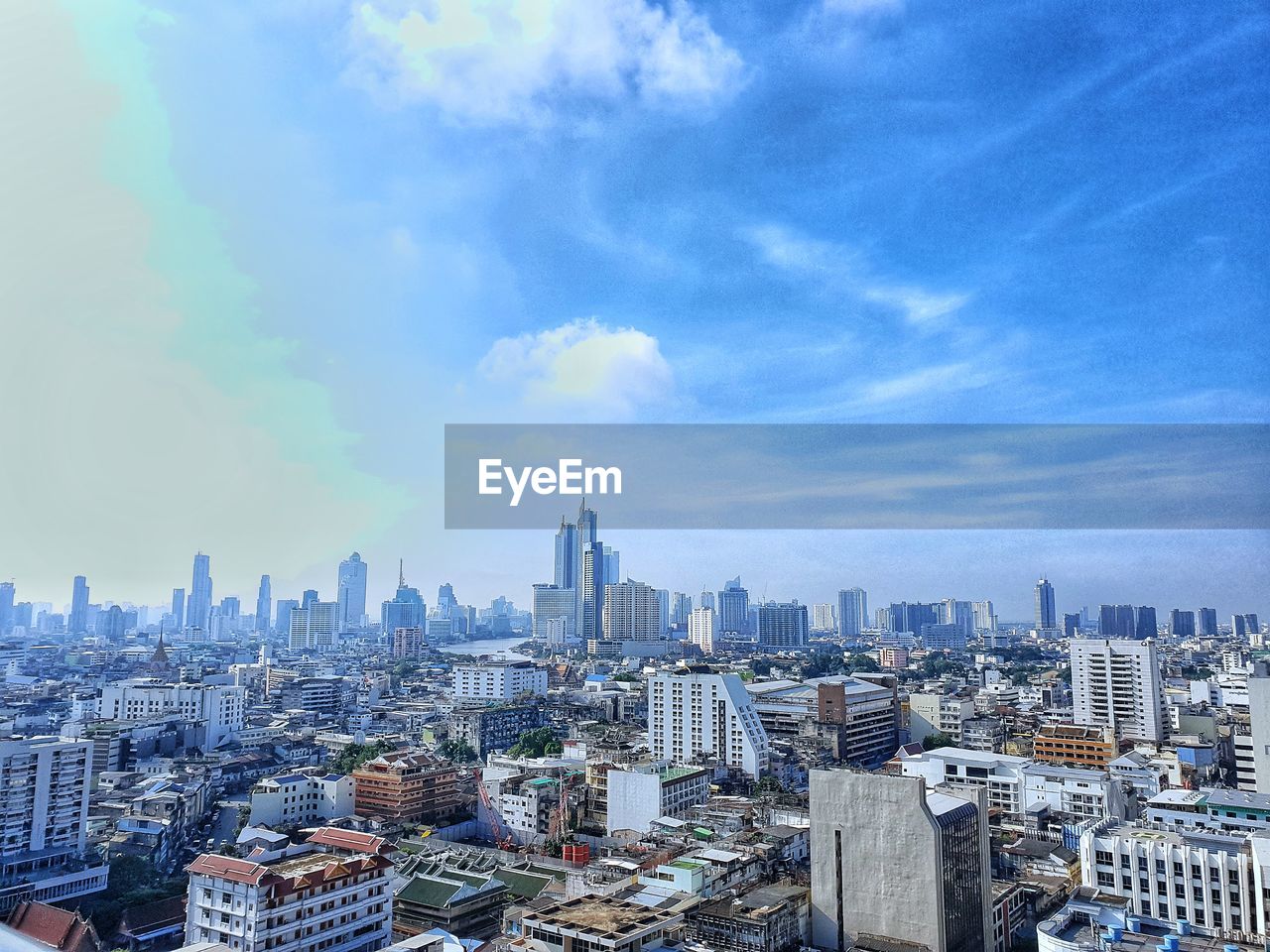 HIGH ANGLE VIEW OF CITY BUILDINGS AGAINST SKY