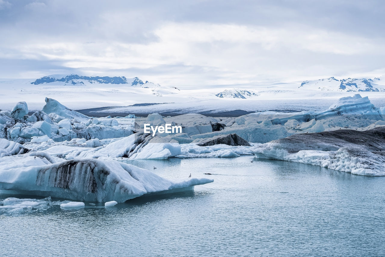 Beautiful icebergs floating in jokulsarlon glacier lagoon in polar climate