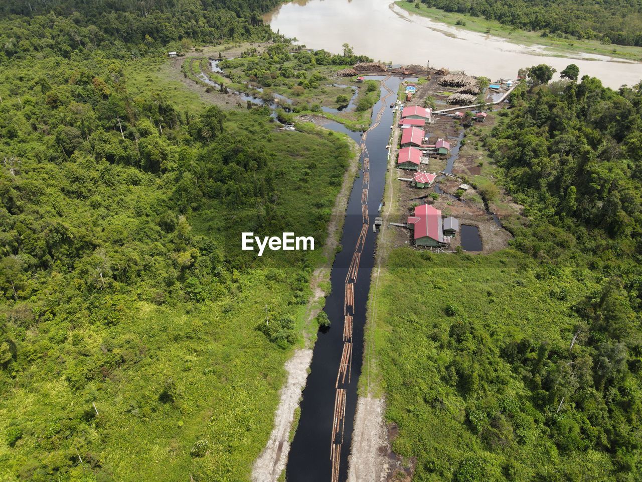 HIGH ANGLE VIEW OF ROAD AMIDST FIELD