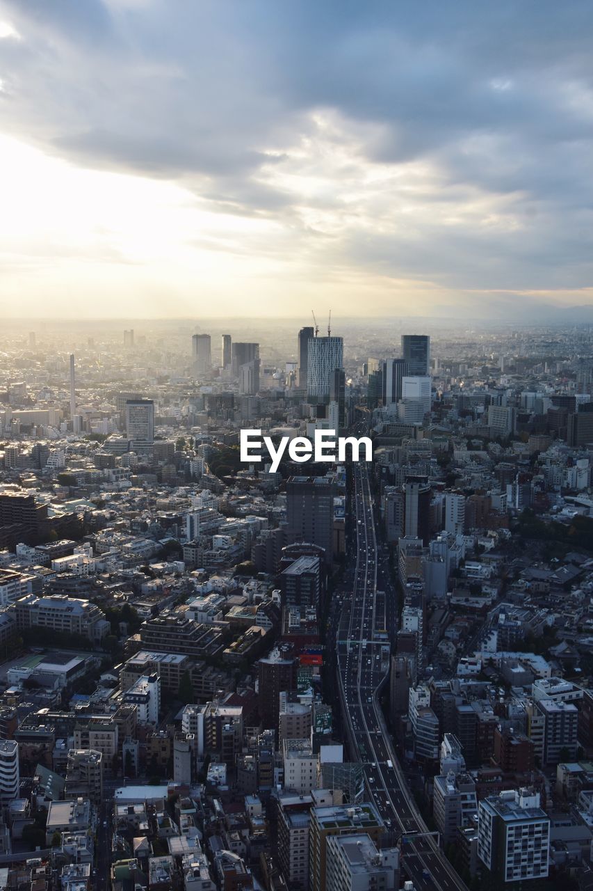 High angle view of modern buildings in city against sky