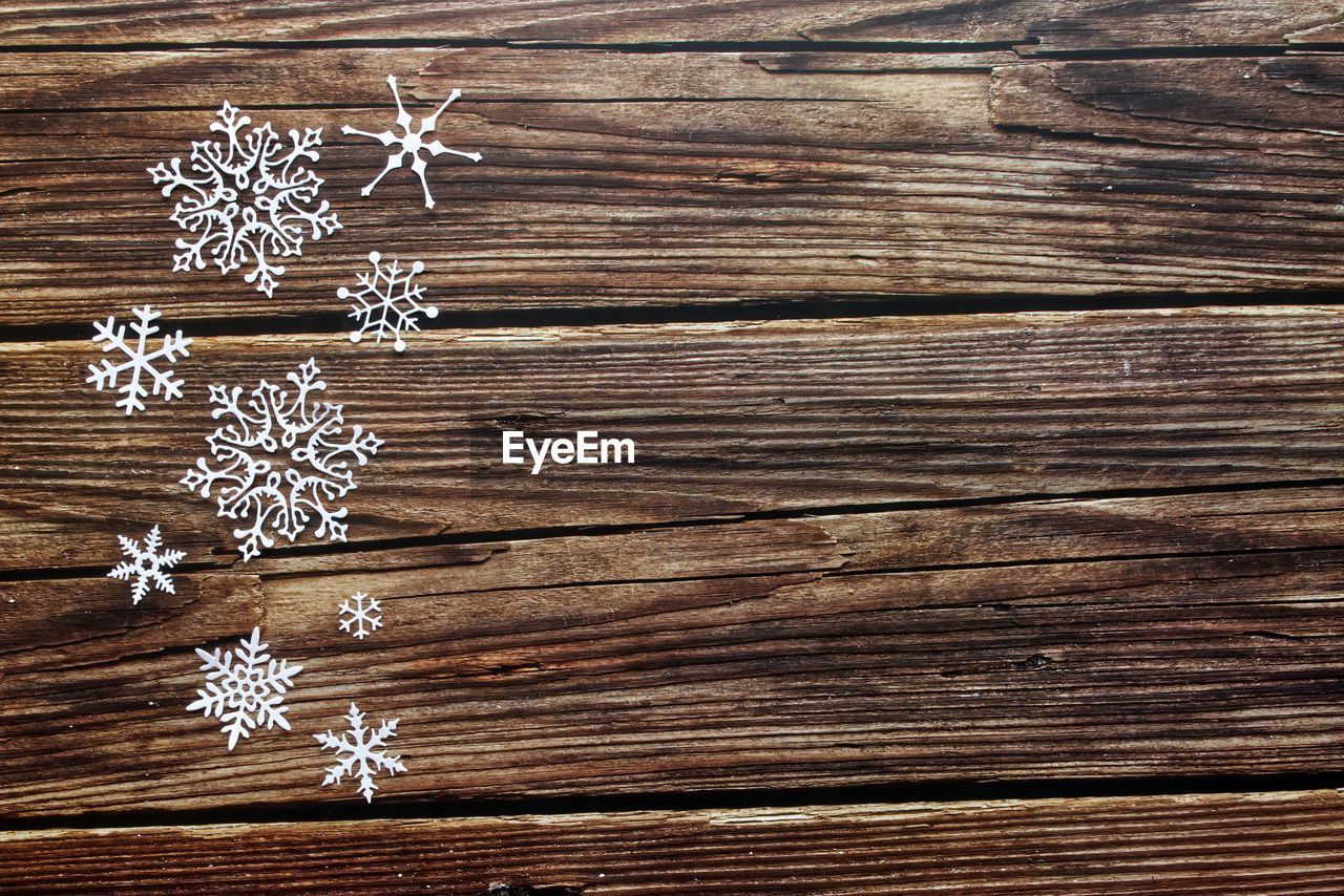 Snow wooden background. background with snowflake, christmas celebration concept.