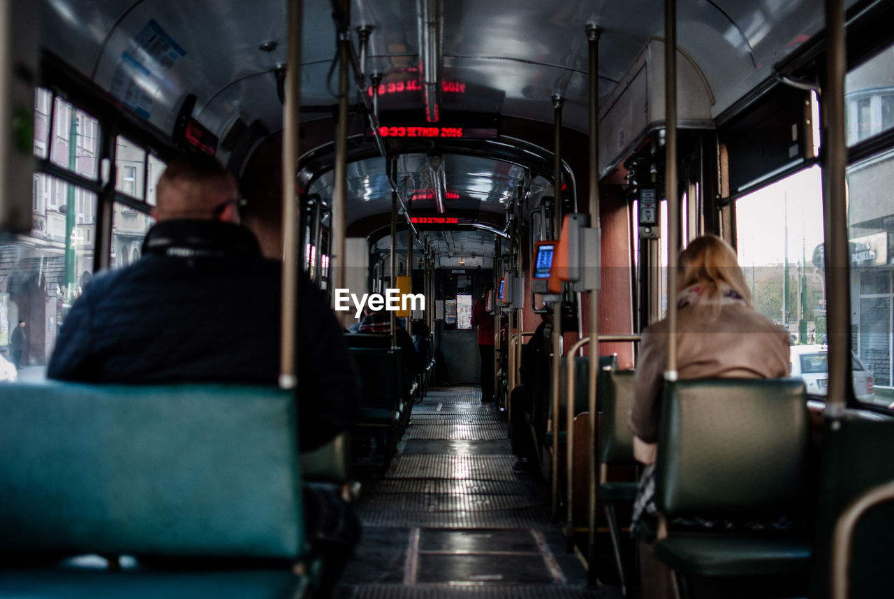 Rear view of people sitting in bus