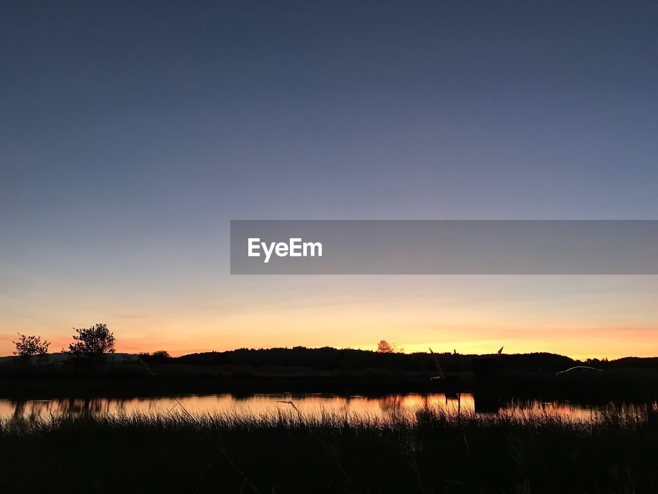 SILHOUETTE LANDSCAPE AGAINST SKY DURING SUNSET