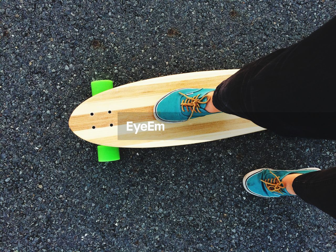 Woman's legs and skateboard