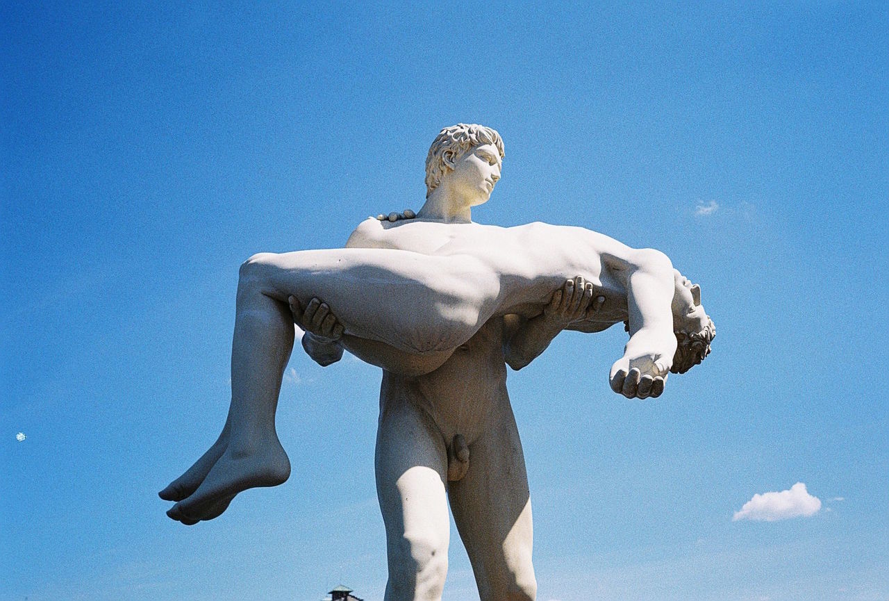 Low angle view of statue against blue sky