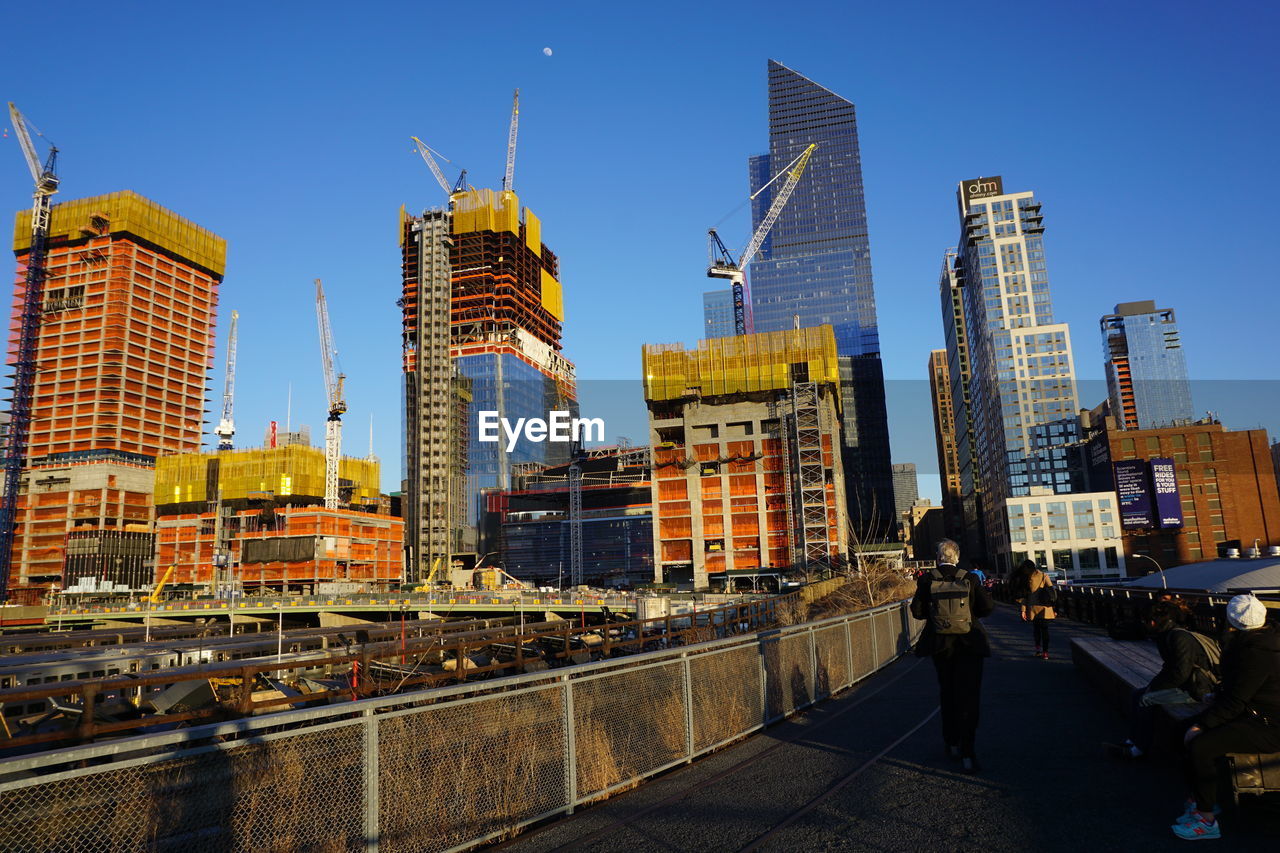 SKYSCRAPERS IN CITY AGAINST SKY