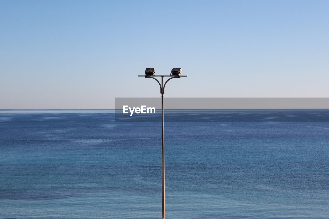 Low angle view of street light against sky