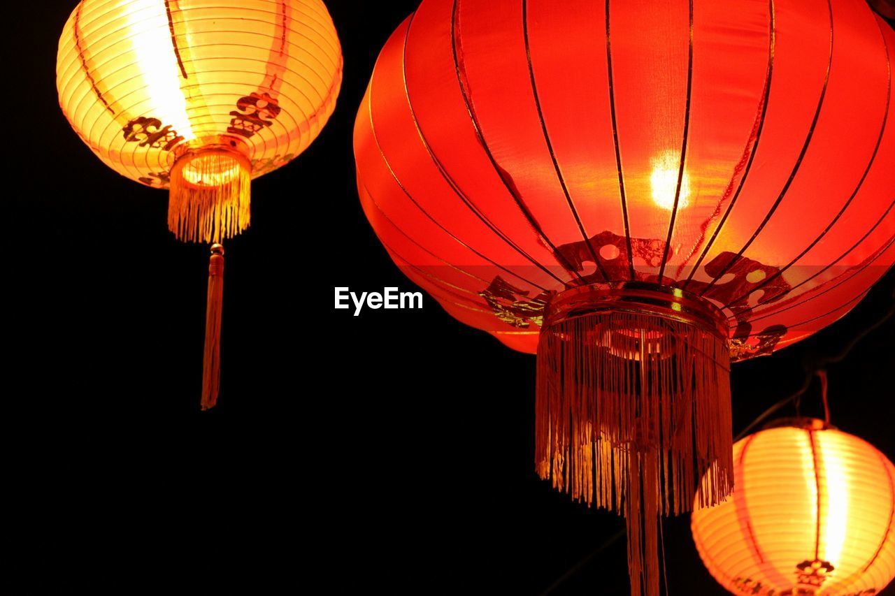 Illuminated lanterns hanging at night