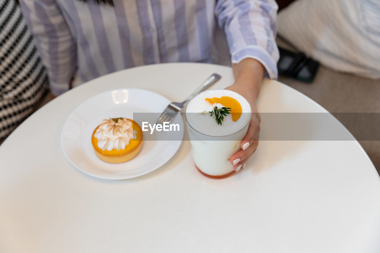 midsection of woman having breakfast