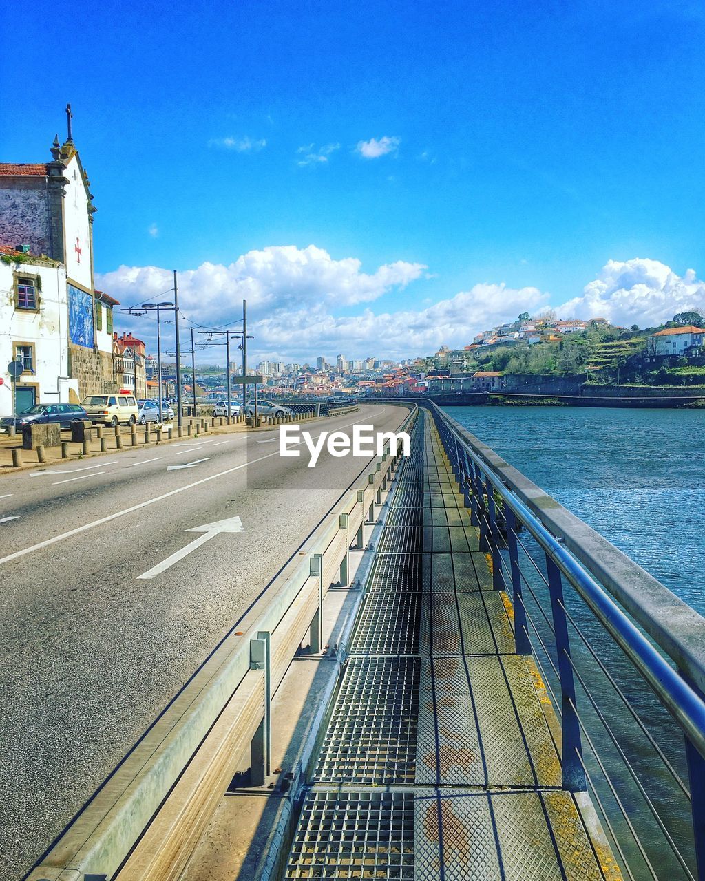 Empty road against cloudy sky