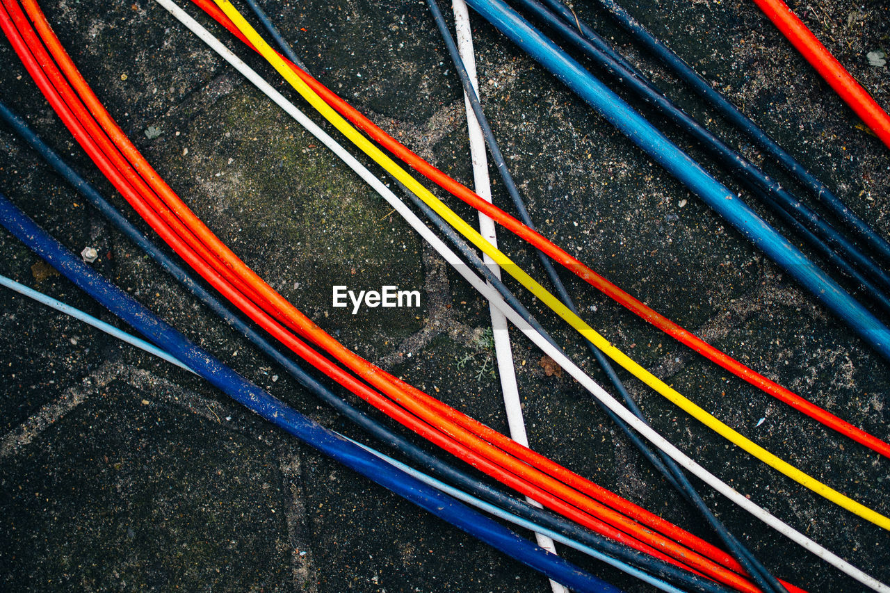 Close-up of colorful cables on ground