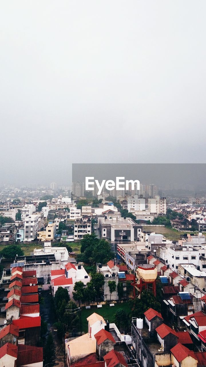 HIGH ANGLE SHOT OF CITYSCAPE AGAINST CLEAR SKY