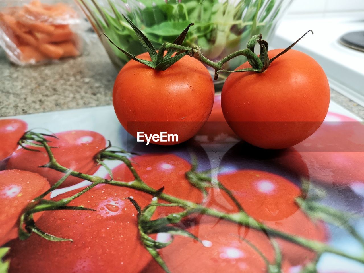 Close-up of tomatoes on place mat