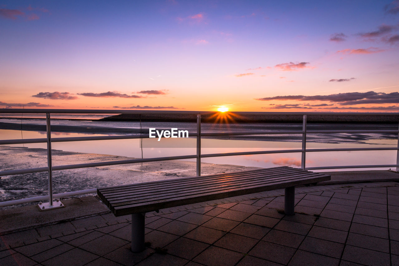 Empty bench against north sea