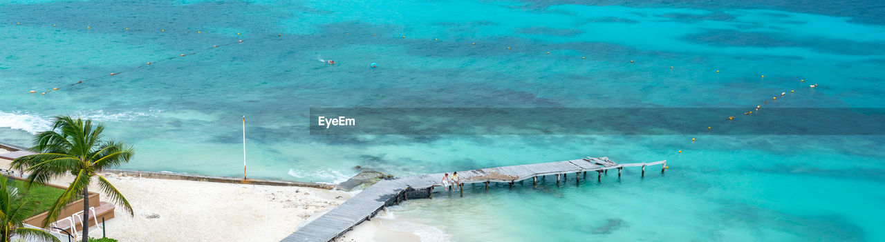 water, nature, sea, turquoise colored, tropical climate, swimming pool, high angle view, beauty in nature, day, no people, blue, scenics - nature, reef, ocean, tranquility, land, outdoors, travel destinations, beach, tranquil scene, palm tree, travel, idyllic, plant, tree, vacation, trip, tourist resort