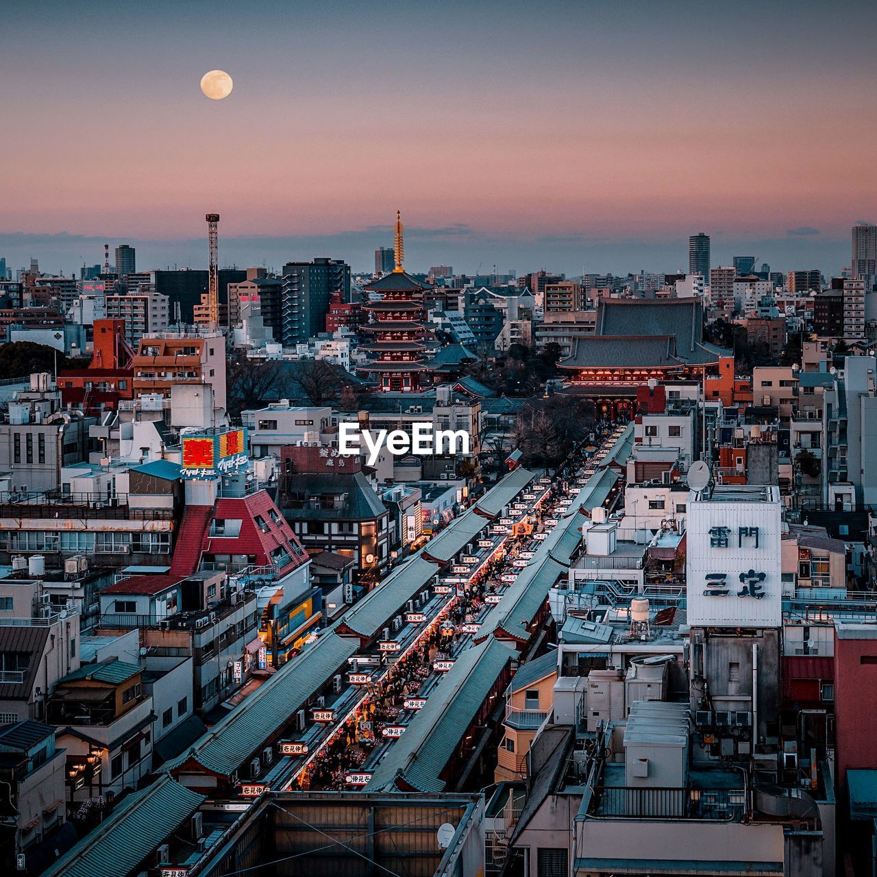 High angle view of city buildings against sky during sunset