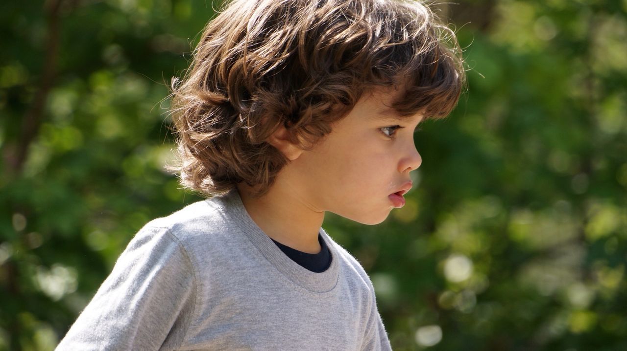 Close-up of boy playing outdoors