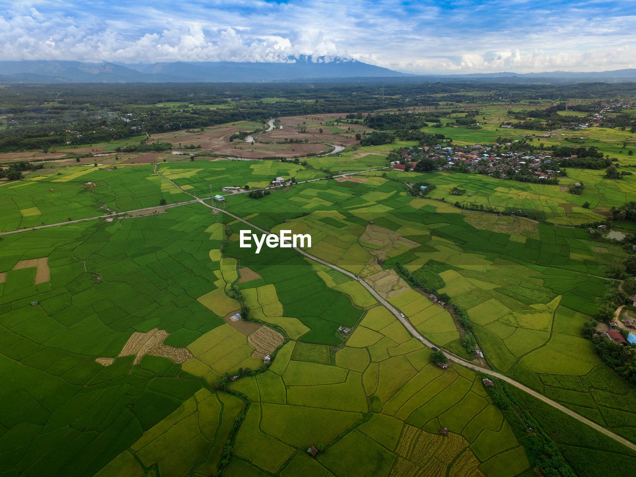 Aerial view of landscape against cloudy sky