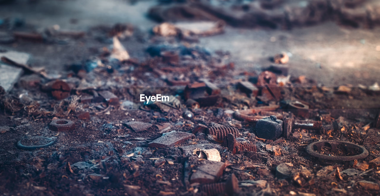 Close-up of rusty metal on field