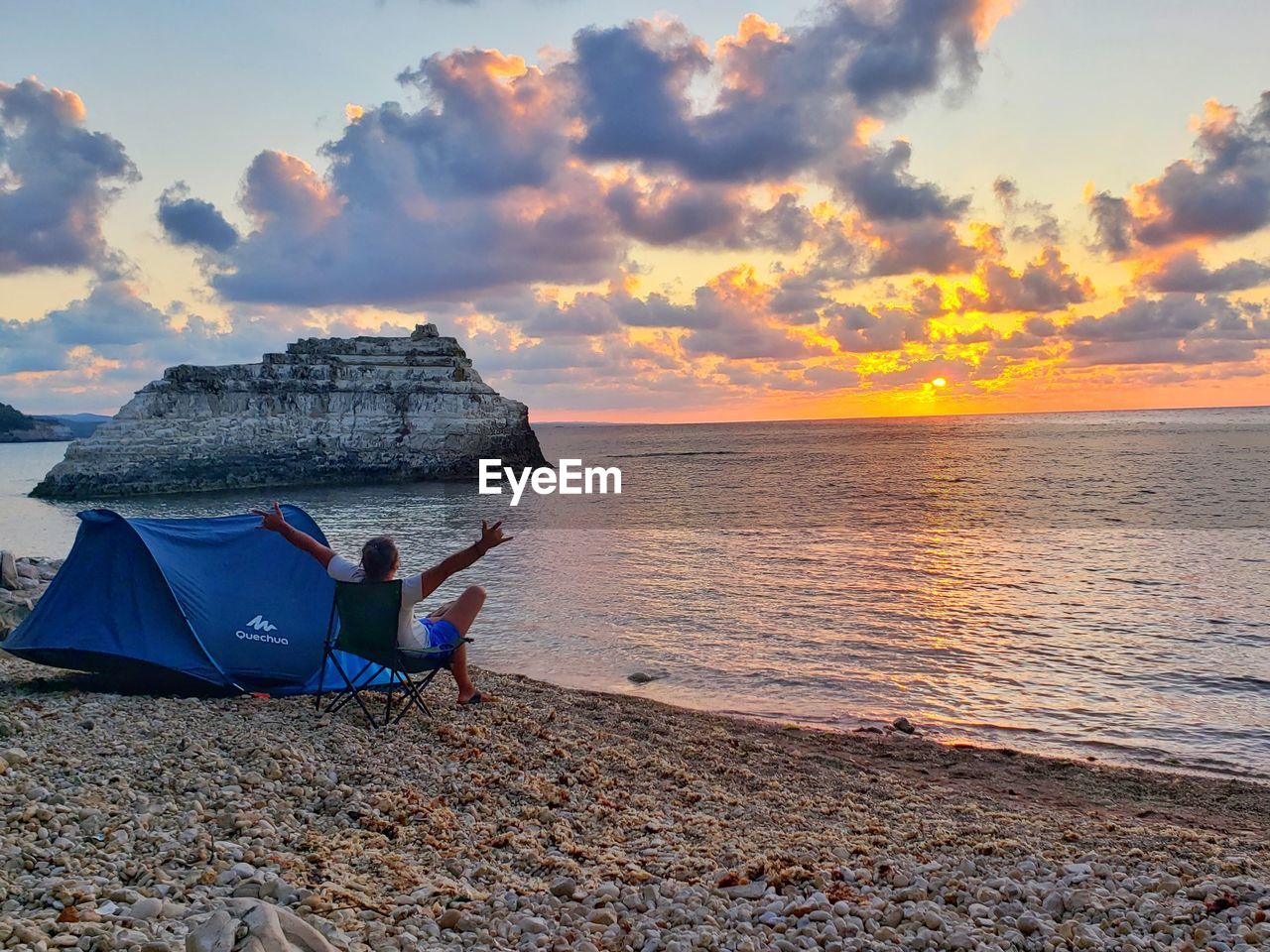 SCENIC VIEW OF BEACH DURING SUNSET