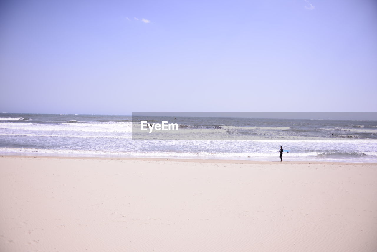 Scenic view of beach against clear sky