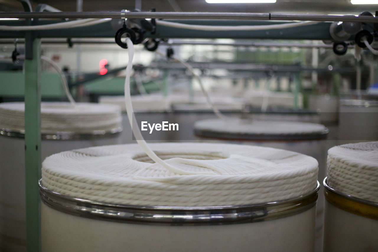 Close-up of machinery of cotton thread production