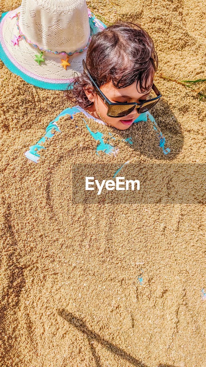 High angle view of girl on sand