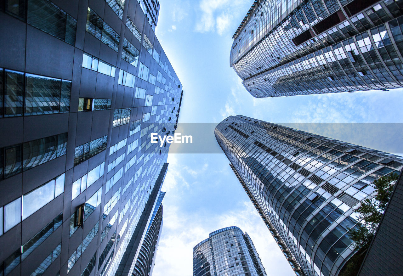 Low angle view of modern buildings against sky