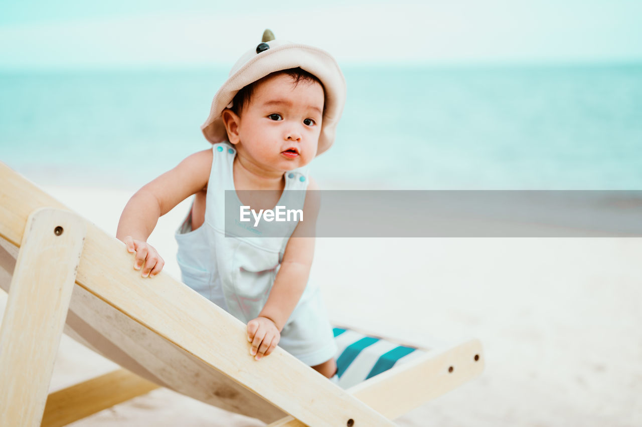 Cute baby girl on beach