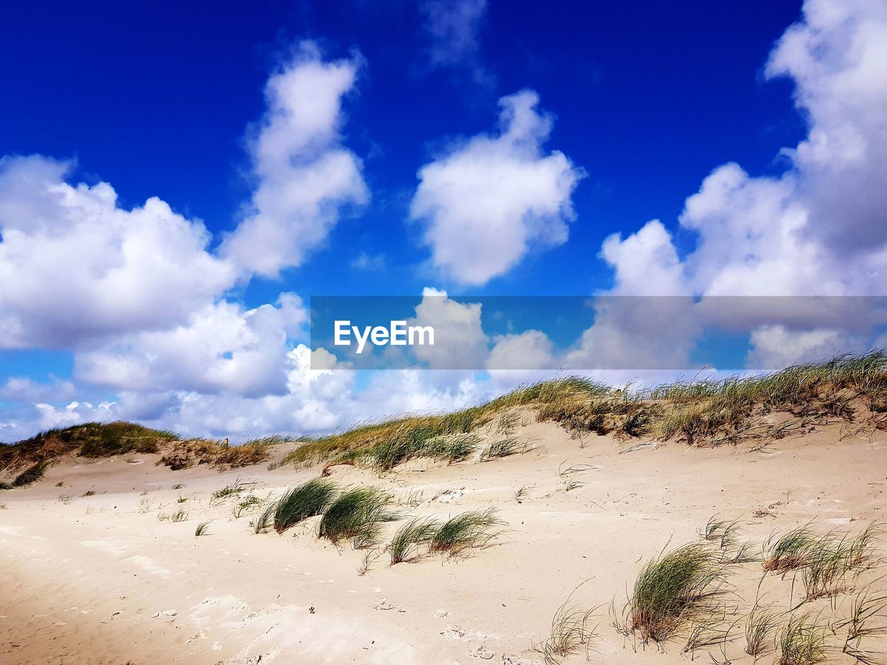 Panoramic view of dune against sky