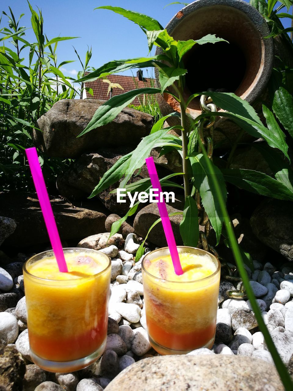 CLOSE-UP OF DRINK ON TABLE AGAINST GLASS