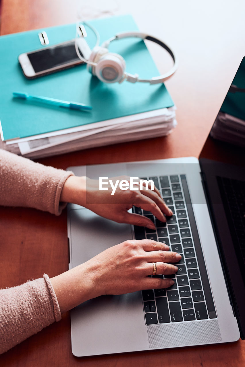 Woman working talking doing her job remotely during video chat phone call on laptop from home