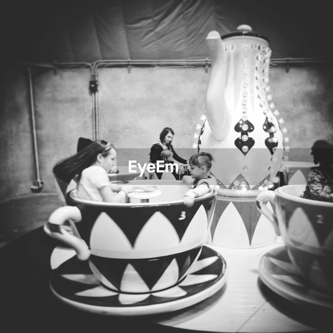 TWO PEOPLE SITTING IN KITCHEN