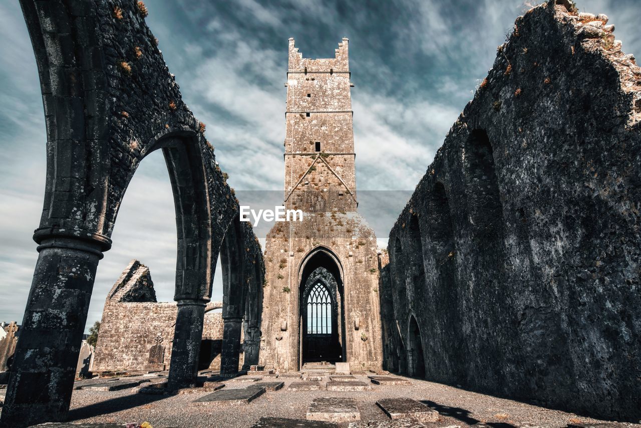 Dramatic scene of historical landmark claregalway friary in county galway, ireland