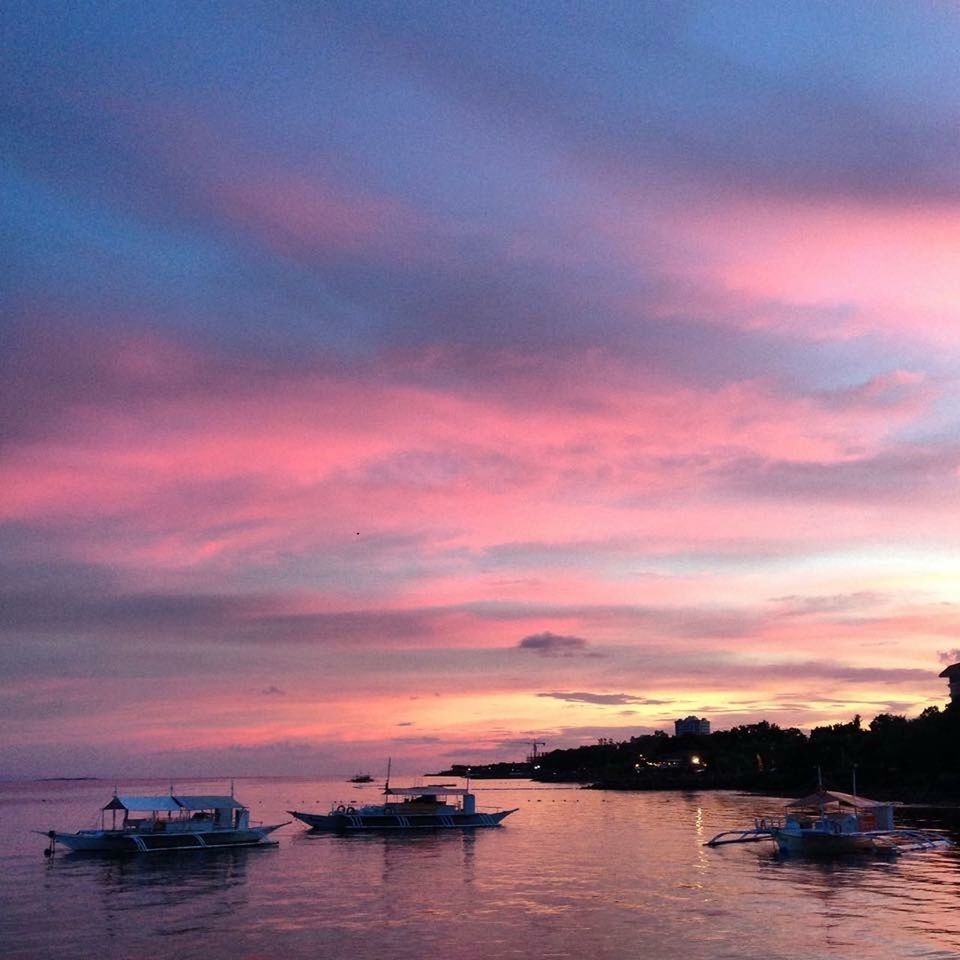 SCENIC VIEW OF SUNSET OVER SEA