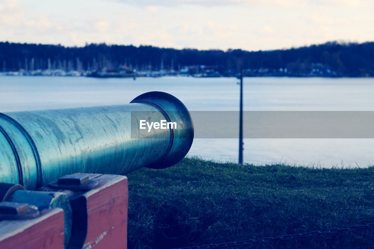 CLOSE-UP OF WATER PIPE AGAINST SKY