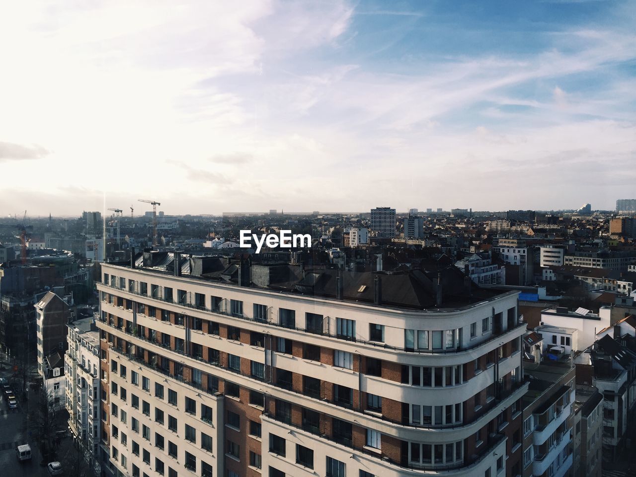 High angle view of buildings in city against sky