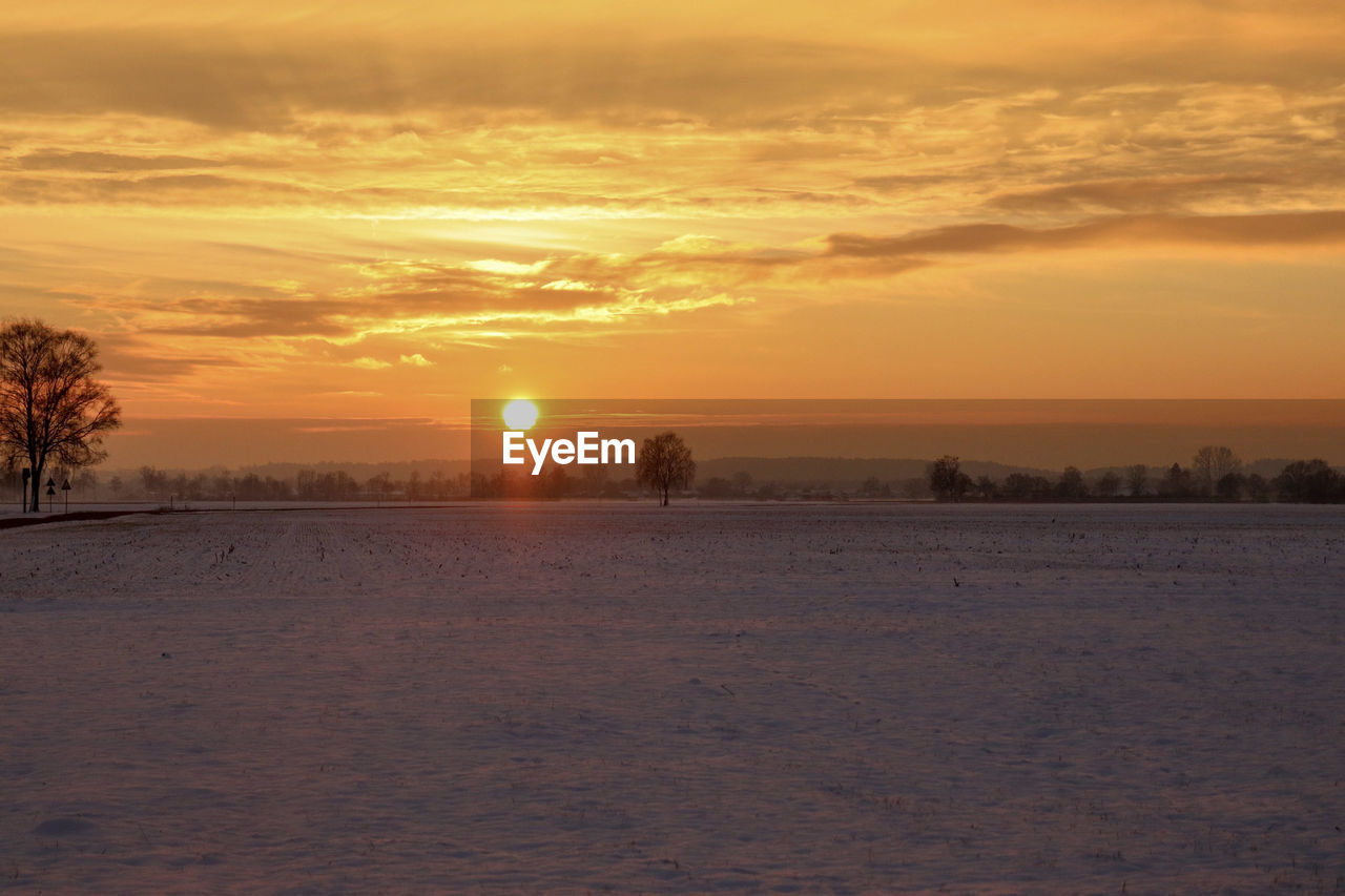 SCENIC VIEW OF LANDSCAPE AGAINST SKY DURING SUNSET