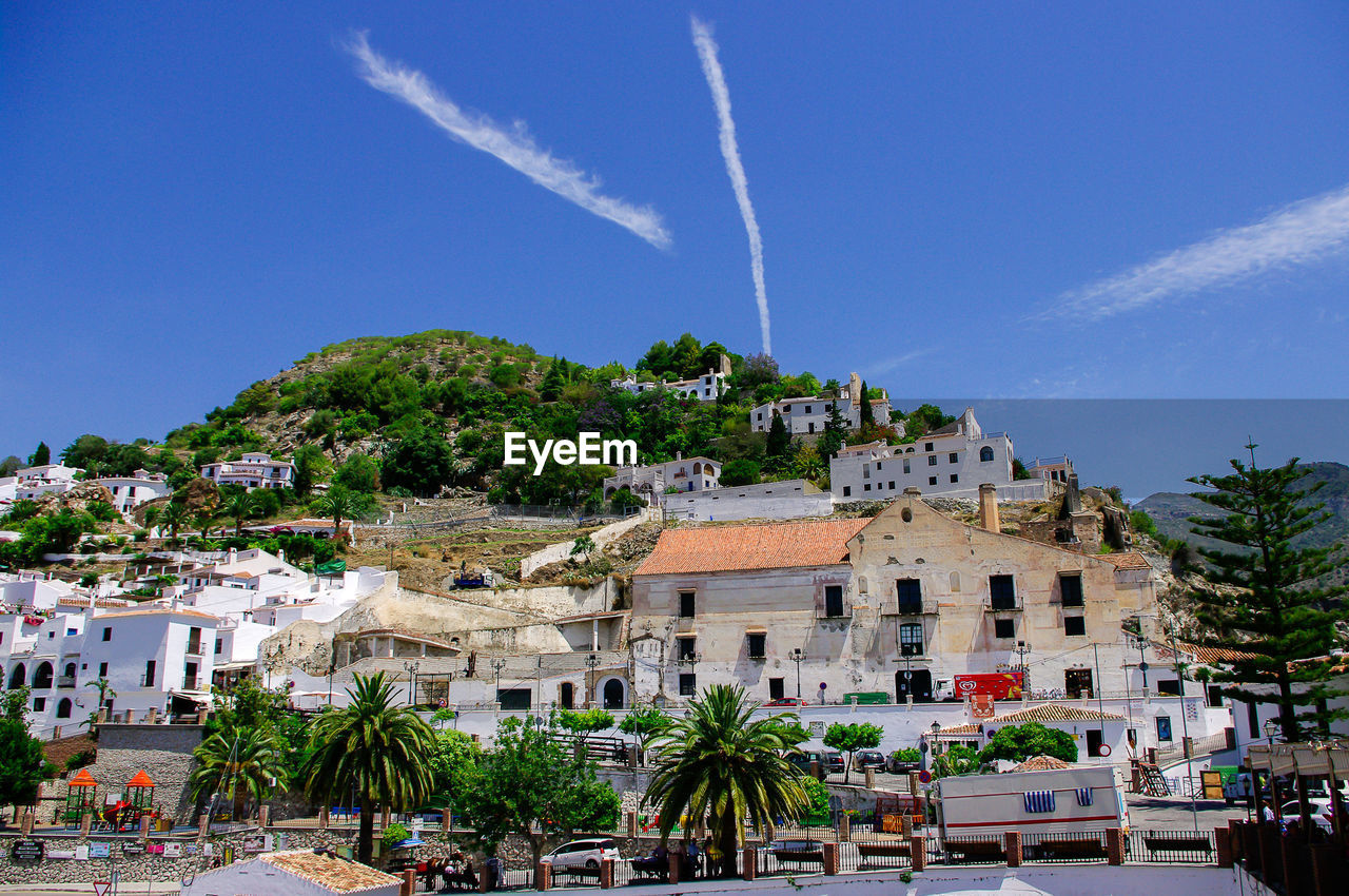 Low angle view of houses on mountain