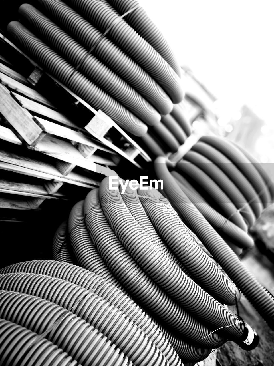 FULL FRAME SHOT OF PIPES ON STACK OF STACKED